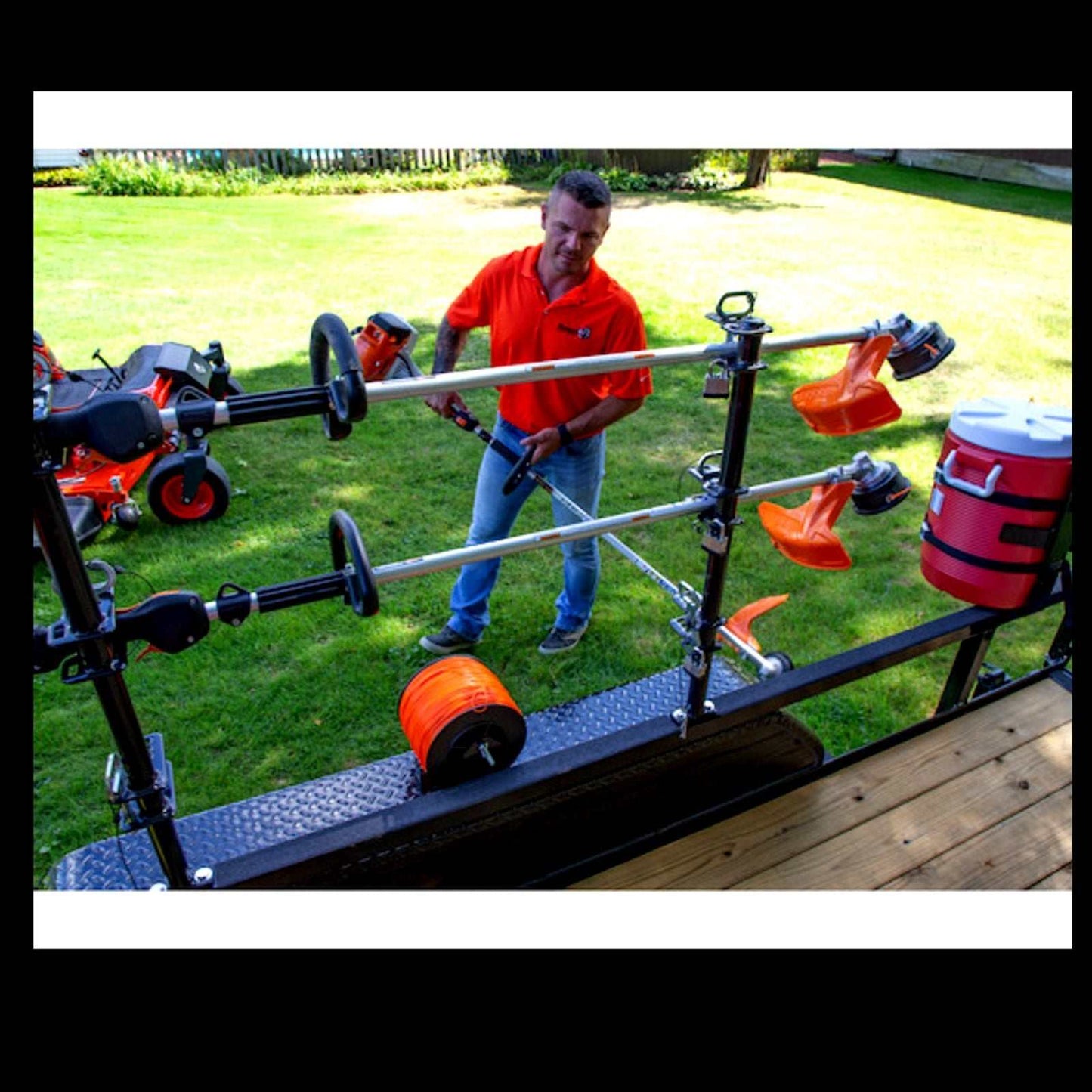 Lockable trimmer rack for open trailer with snap-in design and rust-resistant steel